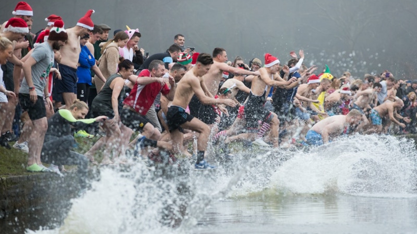 Swimmers brave the elements for Christmas Day dip | ITV News