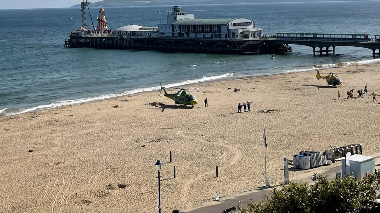 Two people taken to hospital after being pulled from sea at