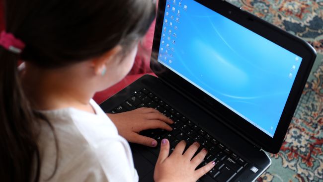 EMBARGOED TO 0001 MONDAY SEPTEMBER 7 File photo dated 21/08/14 of a child using a laptop computer. Six out of 10 teachers say they are worried about their pupils� safety online after many became dependent on the internet to continue learning amid lockdown, according to a survey.
