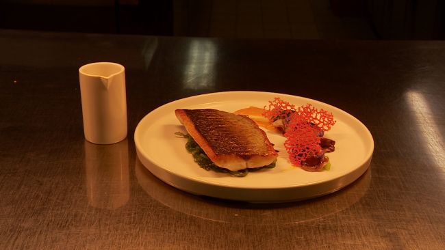 A sea bass dish completed by National Young Chef of the Year nominee Jacob Gosselin.