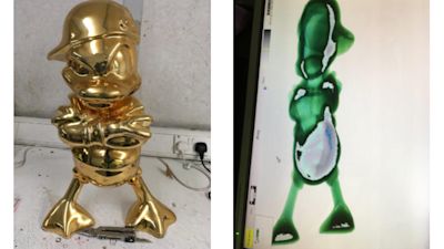 Gold-coloured duck statue