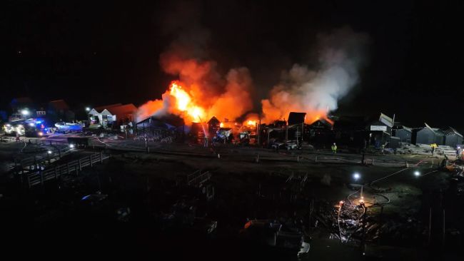 Drone footage of the fire that destroyed two chip shops and several fishing huts in Southwold's harbour. 
Credit: NCD Media