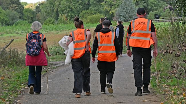 Volunteers gathering in a field during the search for a missing three-year-old in Suffolk.