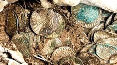Close up of the 11th century coin hoard discovered on the Sizewell C site dating to around the reign of Edward the Confessor.
Credit: Sizewell C/OCA
