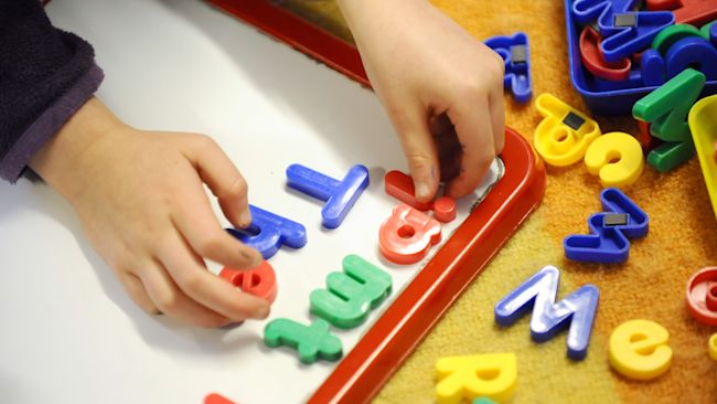 Child learning to spell