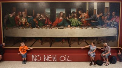 Protesters from Just Stop Oil climate protest group glue their hands to the frame of a copy of Leonardo da Vinci's, The Last Supper inside the Royal Academy, London. Picture date: Tuesday July 5, 2022.
