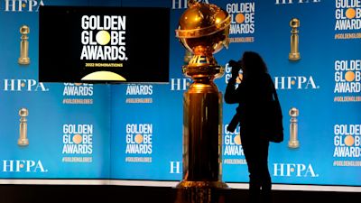 The podium appears prior to the start of the nominations event for 79th annual Golden Globe Awards at the Beverly Hilton Hotel on Monday, Dec. 13, 2021, in Beverly Hills, Calif. The 79th annual Golden Globe Awards will be held on Sunday, Jan. 9, 2022. (AP Photo/Chris Pizzello)