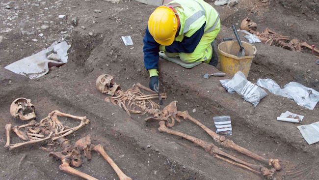 An archaeologist excavating the remains of friars buried in the grounds of the former Augustinian friary in central Cambridge.
Credit: Cambridge University/PA