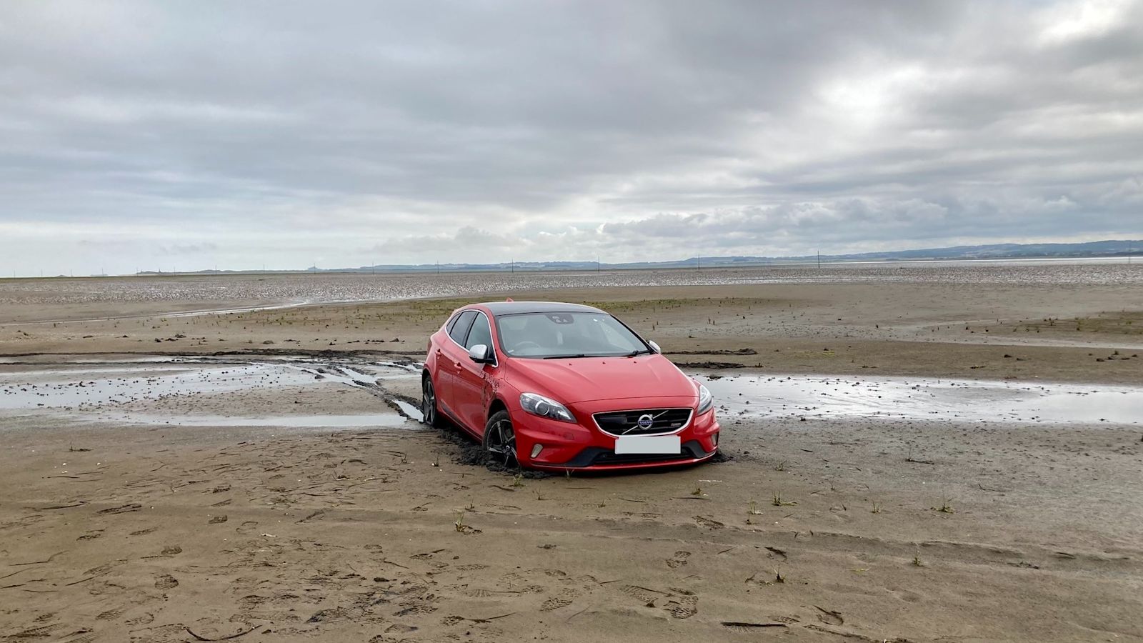 Car pulled from soft sand after driving off causeway to Holy Island ...