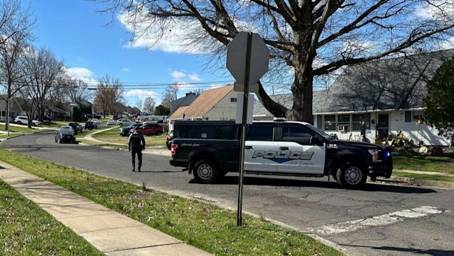 Police patrol a neighborhood after a shooting on Saturday, March 16, 2024 in Levittown, Pa. Several people have been shot after gunfire erupted in a suburban Philadelphia township, prompting authorities to warn residents to hunker down in their homes and forcing cancellation of a St. Patrick’s Day parade and a children’s theme park. (AP Photo/Michael Catalini)