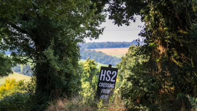 A HS2 sign in an area of natural habitat