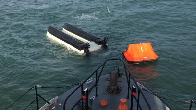 Lifeboat and capsized boat