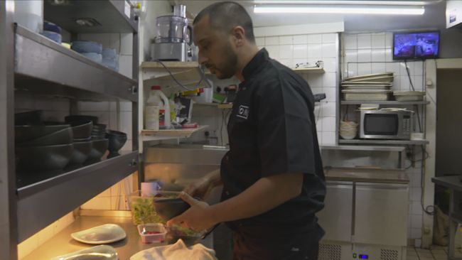 Rehan Uddin cooking in the kitchen at Bombay Express, Torquay