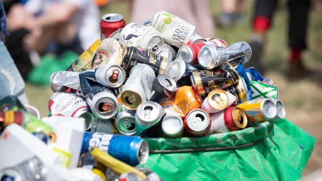 Drinks cans overflow a recycling bin on day 3 of Glastonbury 2019, Worthy Farm, Pilton, Somerset. Picture date: Friday 28th June 2019. Photo credit should read: David Jensen/EmpicsEntertainment