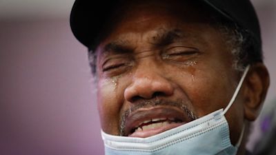 Samuel Nunez cries as eulogizes his daughter, Lydia Nunez, who died from COVID-19, during a funeral service in memory of Nunez at the Metropolitan Baptist Church, LA