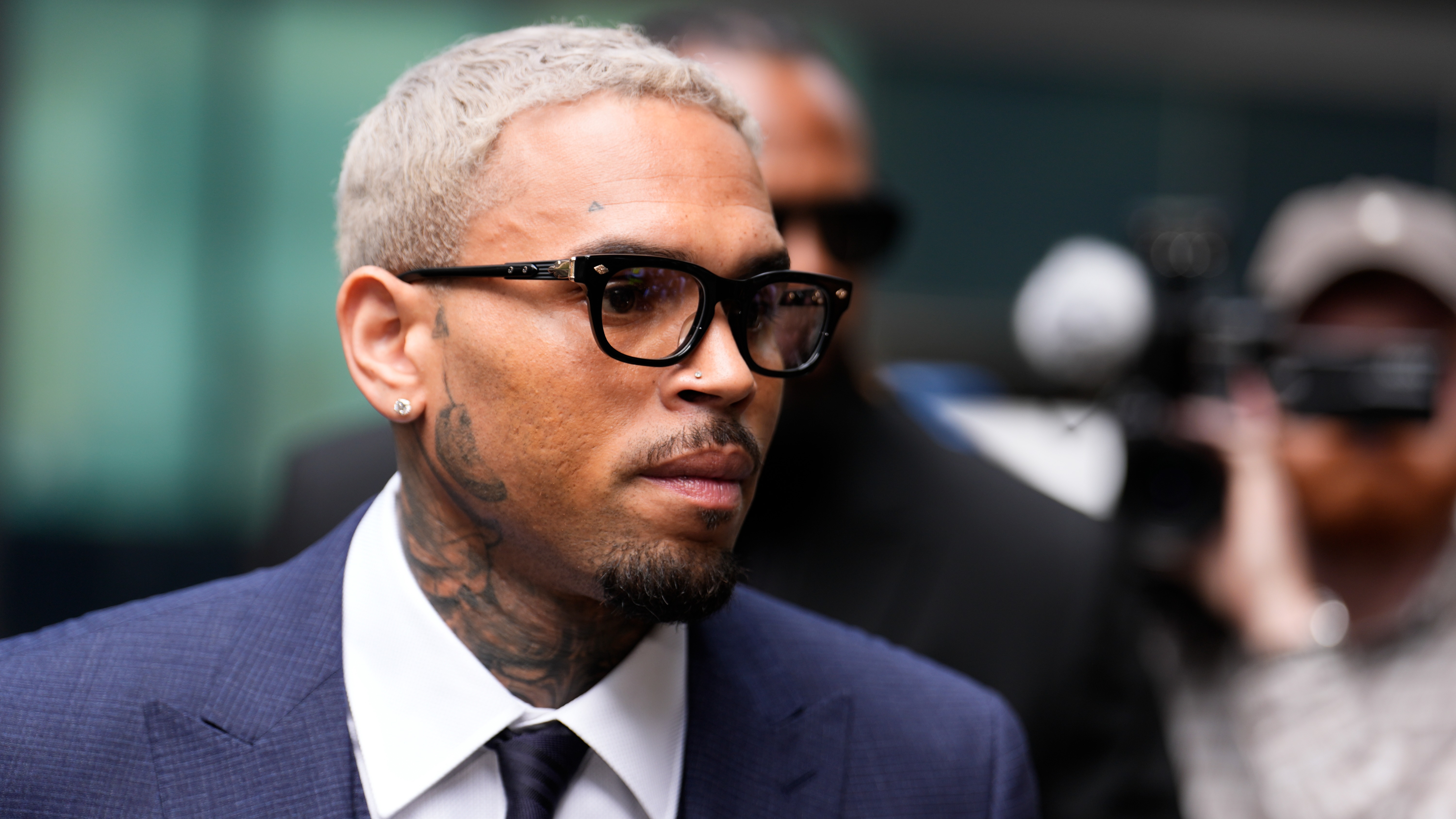 Chris Brown pleads not guilty to 'bottle attack' charge