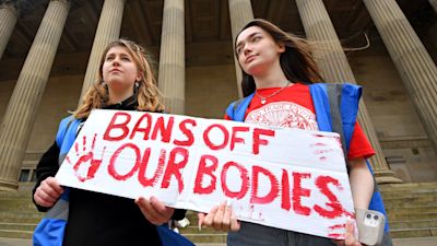 Protest over the Supreme Court abortion ruling at St Georges Hall, Liverpool. Pictured Bella Simspon (left) and Maddie Cooke (right).