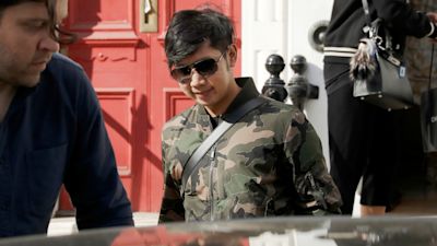 Vorayuth Yoovidhya, whose grandfather co-founded energy drink company Red Bull, walks to get in a car as he leaves a house in London. Thai authorities who’ve issued an arrest warrant for the Red Bull heir accused of an alleged hit-and-run that killed a police officer almost five years ago, flew from Bangkok to Singapore two days before he was supposed to appear before prosecutors.