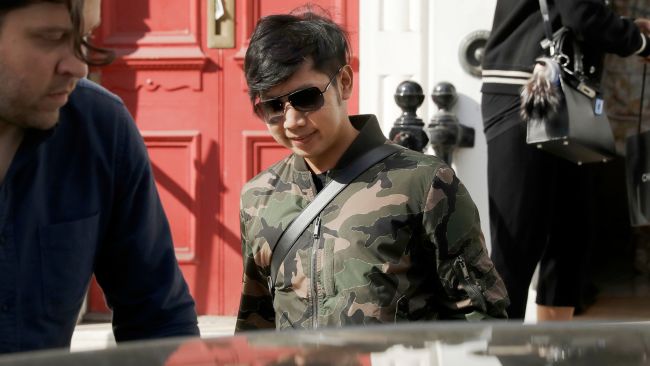 Vorayuth Yoovidhya, whose grandfather co-founded energy drink company Red Bull, walks to get in a car as he leaves a house in London. Thai authorities who’ve issued an arrest warrant for the Red Bull heir accused of an alleged hit-and-run that killed a police officer almost five years ago, flew from Bangkok to Singapore two days before he was supposed to appear before prosecutors. 
