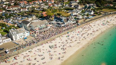 People on cobo beach in Guernsey