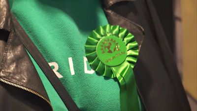 Green Party badge.
Credit: ITV News Anglia