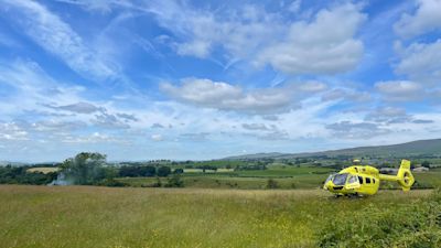 An air ambulance at the scene of a helicopter crash in North Yorkshire