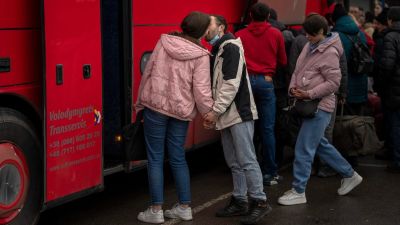 A couple kiss goodbye before the woman boards a bus out of Kyiv, Ukraine, Thursday, Feb. 24, 2022. Russia launched a wide-ranging attack on Ukraine on Thursday, hitting cities and bases with airstrikes or shelling, as civilians piled into trains and cars to flee. Ukraine's government said Russian tanks and troops rolled across the border in a “full-scale war” that could rewrite the geopolitical order and whose fallout already reverberated around the world. (AP Photo/Emilio Morenatti)


