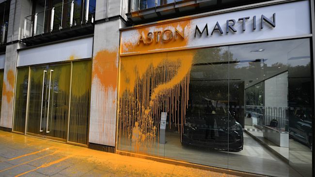 An Aston Martin car showroom on Park Lane in central London which has been sprayed with paint by Just Stop Oil protesters. Picture date: Sunday October 16, 2022.