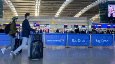 Passengers check-in in terminal 5 at Heathrow Airport