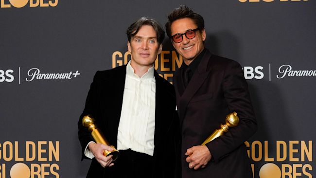 Cillian Murphy and Robert Downey Jr pose with their Golden Globe awards.