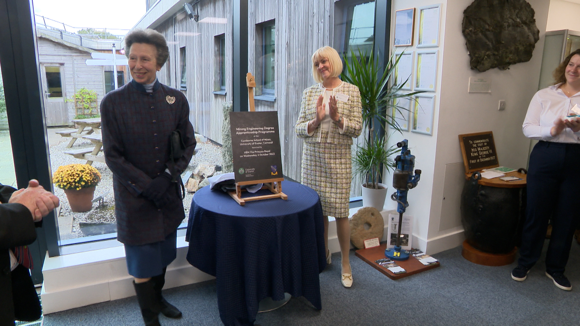 image of the Princess Royal standing next to a plaque on a table