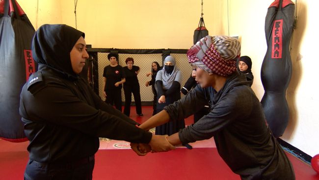Zee Jogi teaching a self defence class to a range of women of all ages