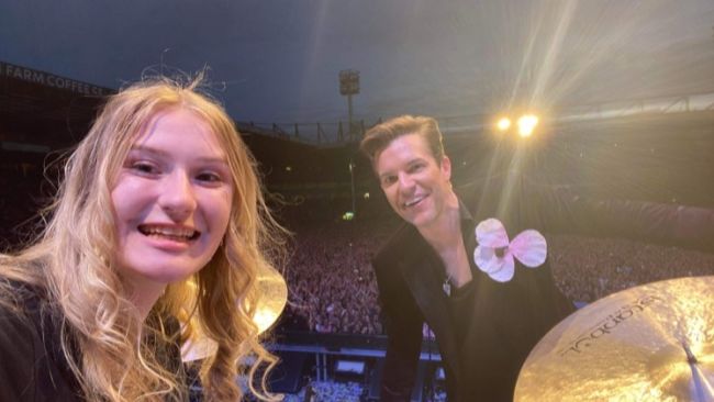 Grace Ellis took a selfie with lead singer Brandon Flowers after the song had finished.