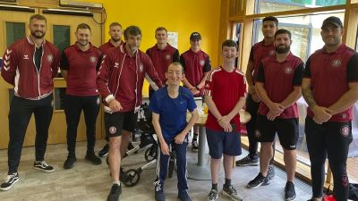 Wigan Warrior stars with young people at Derian House hospice 