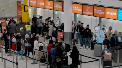 Passengers check-in at the South Terminal of Gatwick Airport in West Sussex which is reopening on Sunday to meet expected strong demand for air travel this summer. The terminal has been dormant since June 15 2020 to reduce costs during the coronavirus pandemic. Picture date: Sunday March 27, 2022.