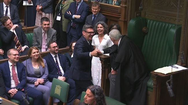 Andy Burnham speaking to Speaker of the House of Commons, Sir Lindsay Hoyle, before being sworn-in as an MP in the Houses of Commons.