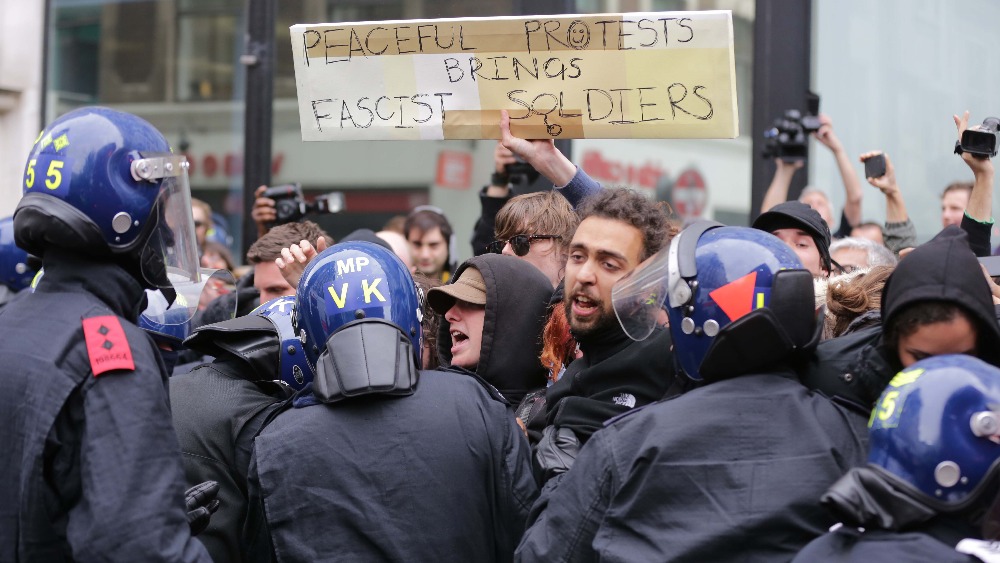 Anti-capitalist Protesters And Police Clash In London | ITV News