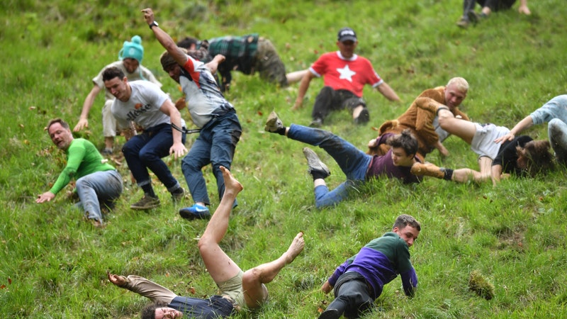 hurtles to glory in annual cheese rolling race | ITV News