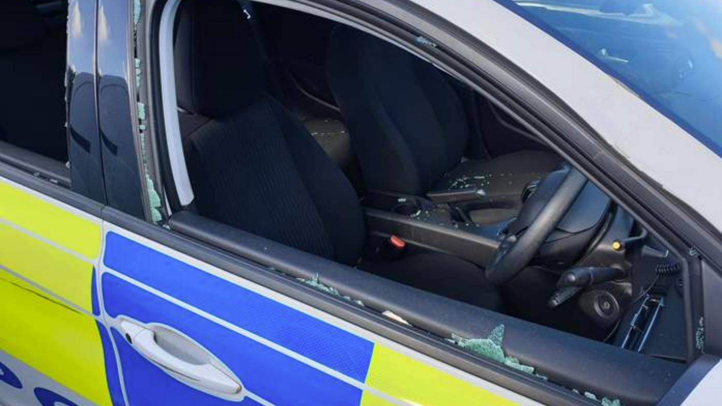 Police condemn 'mindless' vandals who smashed two police cars as ...
