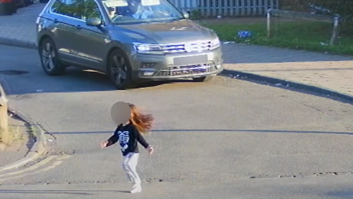 Heroic driver rushes to rescue after runaway toddler darts into busy ...