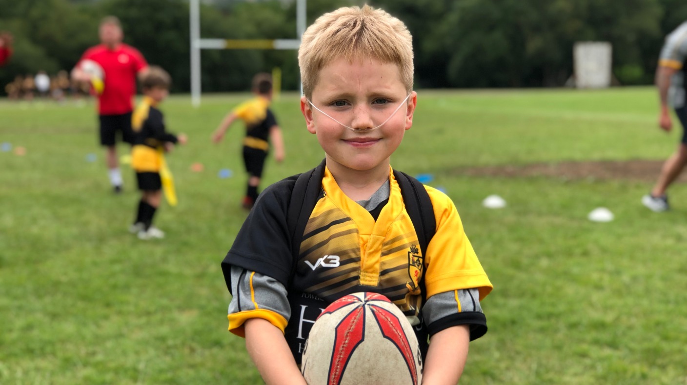 Boy, eight, with rare lung condition plays rugby with oxygen tank on ...