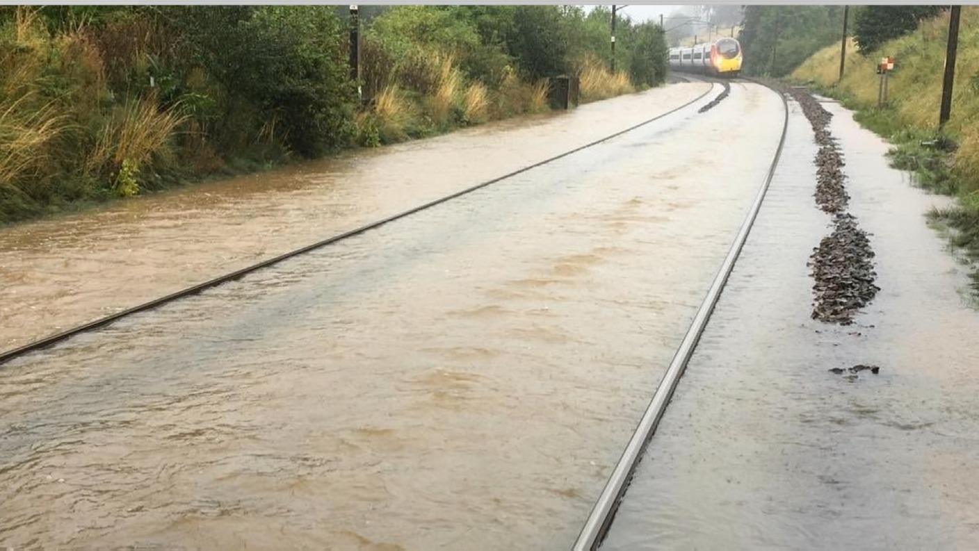 Travel misery as strong winds and flooding bring rail services to a ...