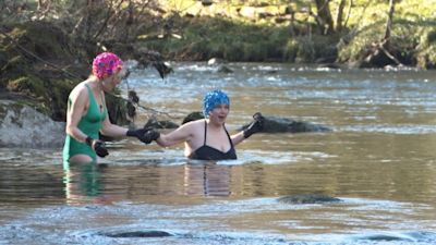 Friends go wild swimming in the River Dart