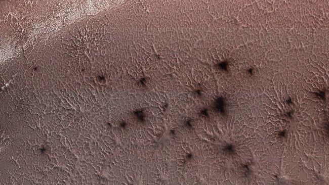 An image of the Martian 'spiders' which has now been recreated by the OU