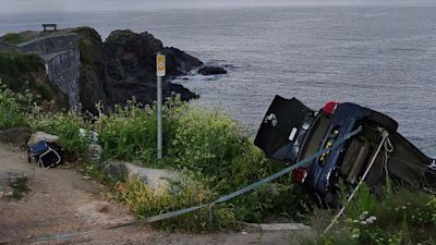Car hangs over cliff edge at Cadgwith
