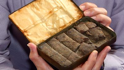 Open tin of 122-year-old chocolate
