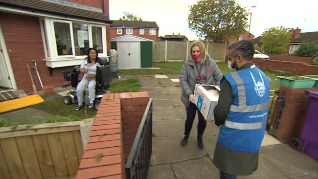 People delivering food parcels