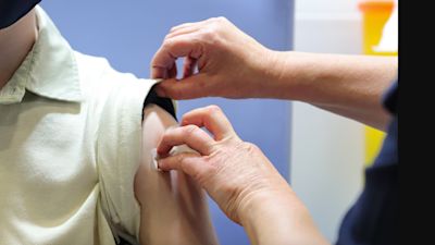 Nurse administers covid vaccine