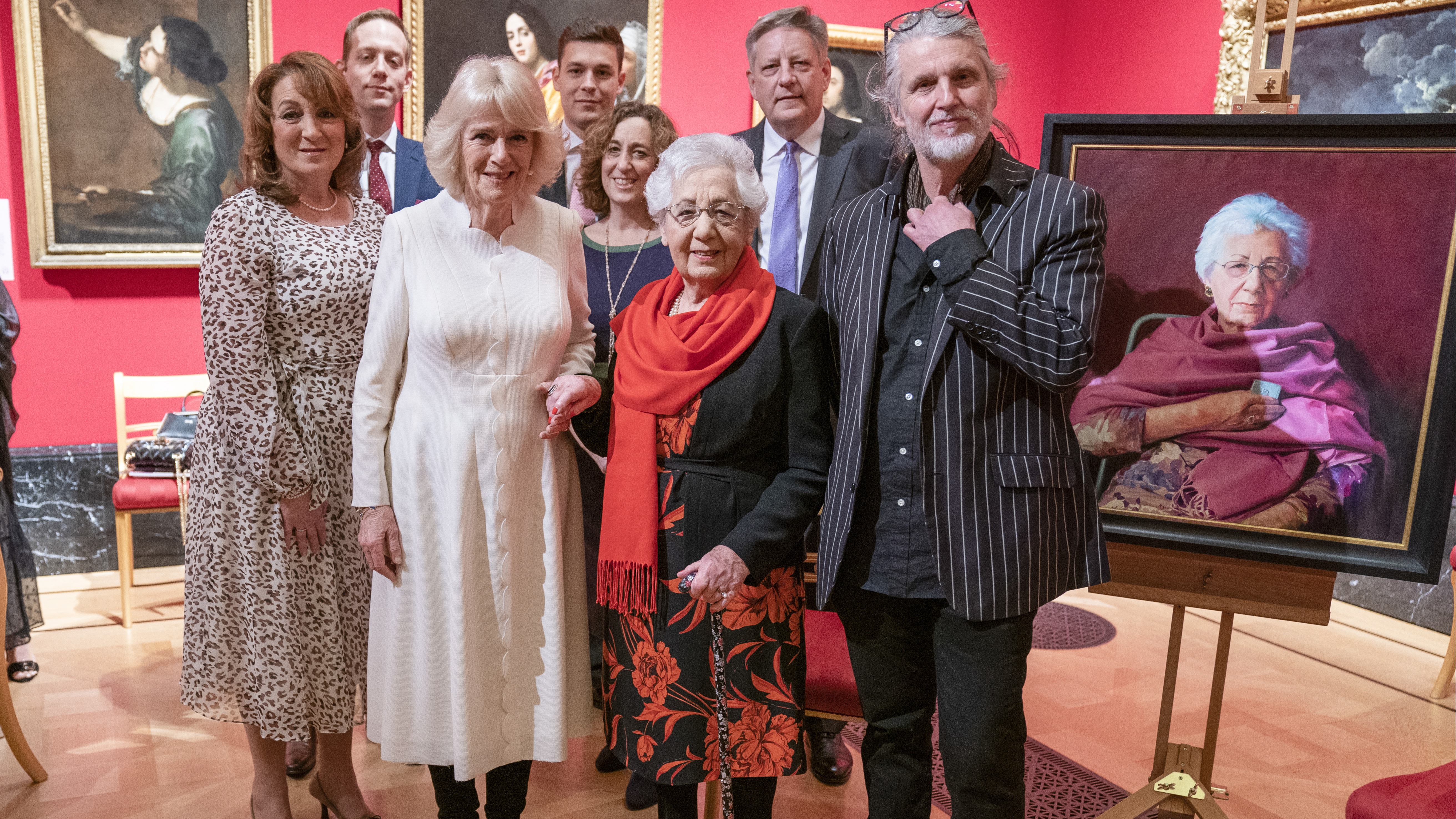 he Duchess of Cornwall with Holocaust survivor Helen Aronson (centre) and her family, and artist Paul Benney (right) beside the portrait of Helen