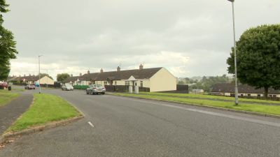 Police at the scene of security alert in Lenadoon. Pic: Pacemaker